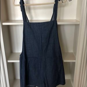 Denim romper with open back and tie shoulder